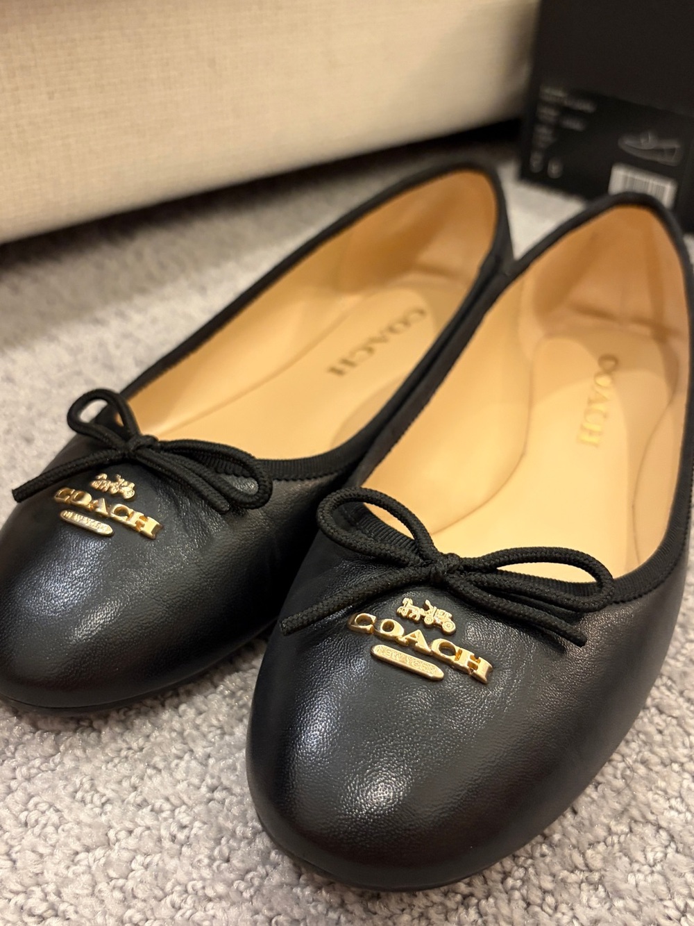 COACH Black Leather Ballet Flats with Gold Logo Bow